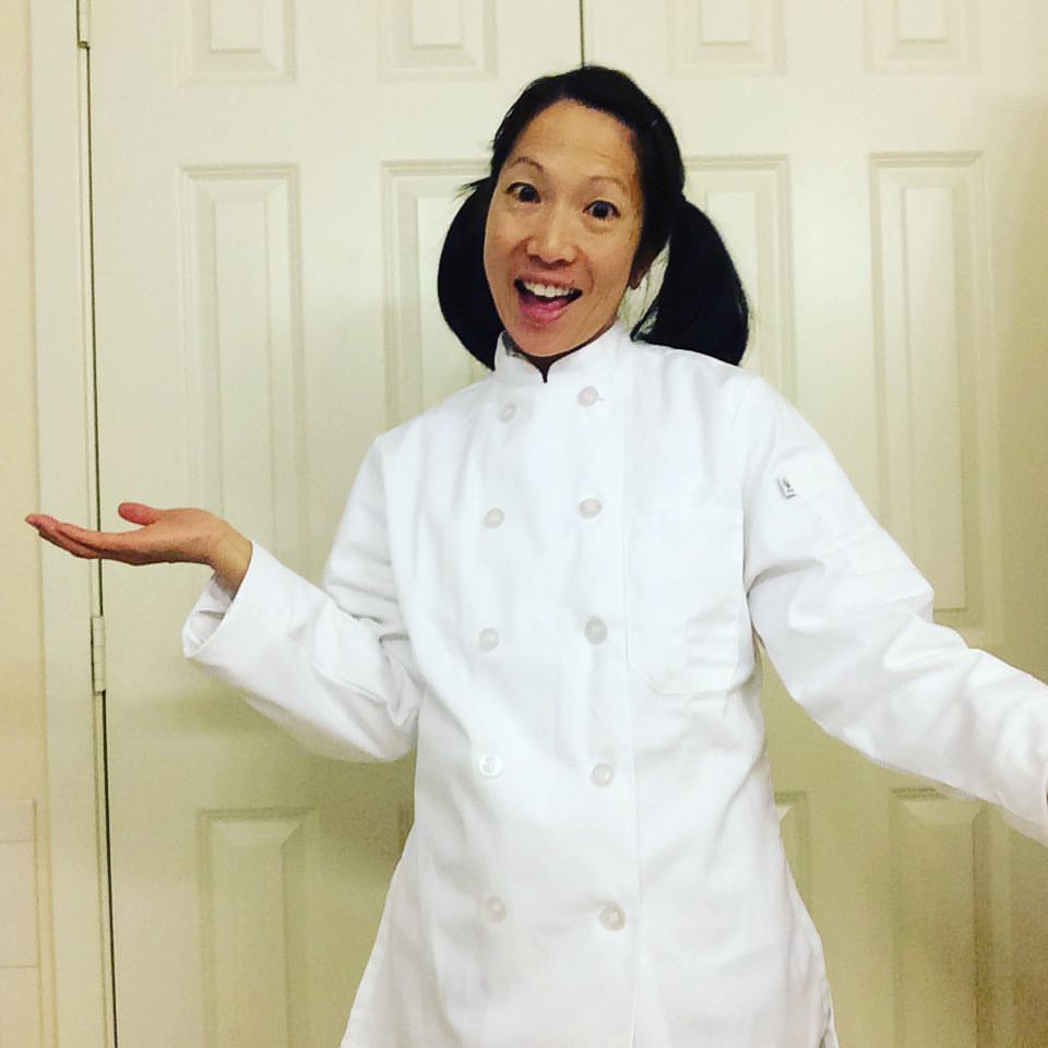 Author wearing white double button chef's coat.