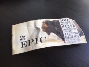 EPIC Bison bar laying on a dark brown coffee table