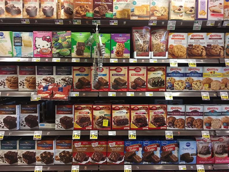 Cake mixes of a variety of brands on the supermarket shelves. 